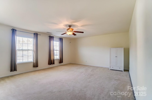 empty room with light carpet and ceiling fan