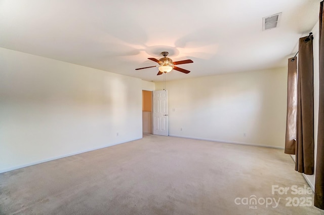 unfurnished room with ceiling fan and light colored carpet