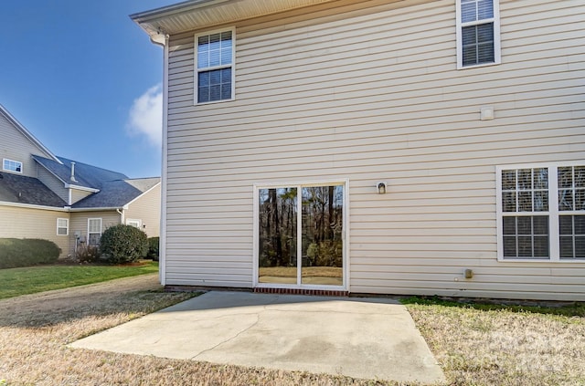 back of property featuring a patio area