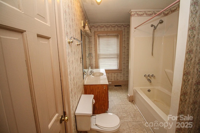 full bathroom with bathing tub / shower combination, vanity, and toilet