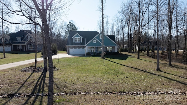 view of front of house featuring a front yard and a garage