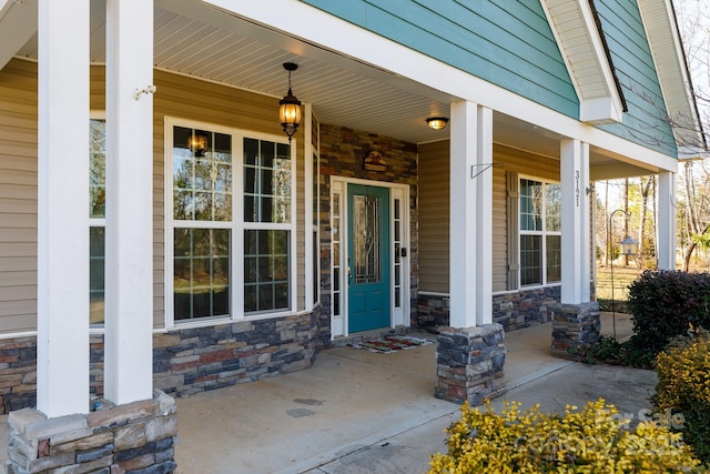 doorway to property with covered porch