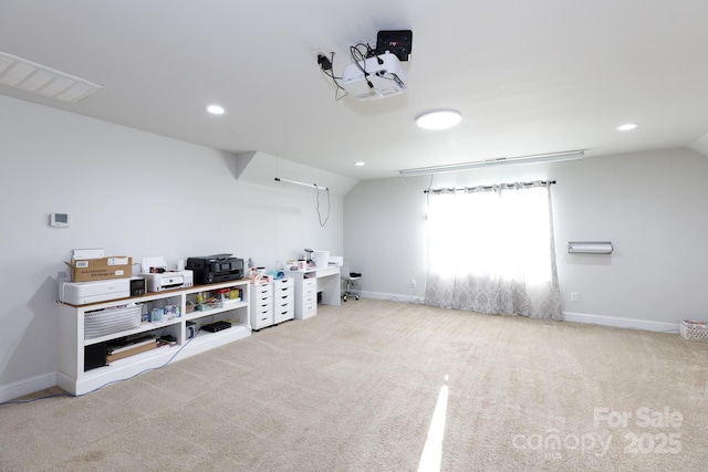 interior space with light colored carpet and lofted ceiling