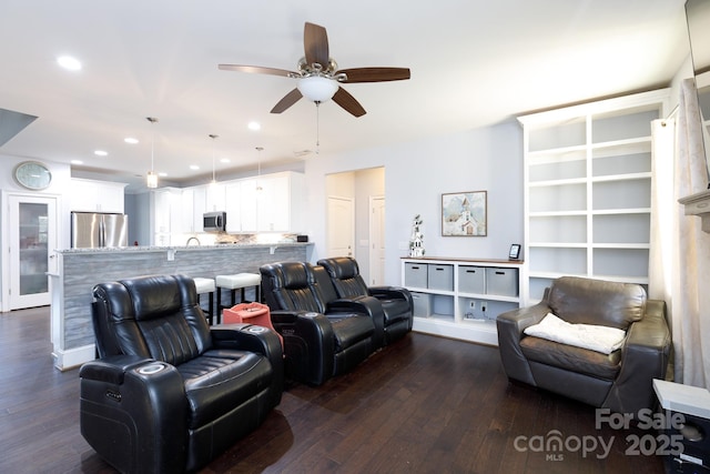 living room featuring dark hardwood / wood-style floors and ceiling fan