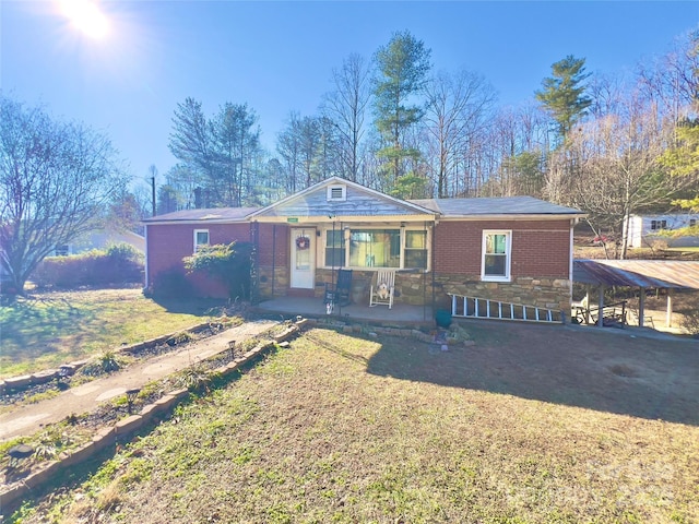 ranch-style home with a front lawn