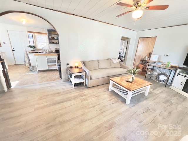 living room with light hardwood / wood-style flooring, wooden ceiling, and ceiling fan