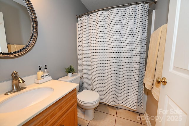 bathroom featuring vanity, a shower with shower curtain, tile patterned floors, and toilet