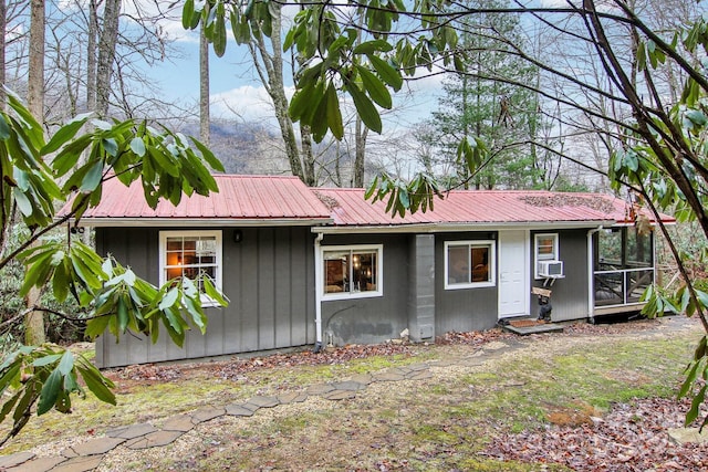 ranch-style home with cooling unit