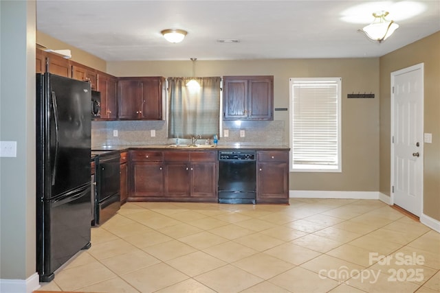 kitchen with decorative backsplash, light tile patterned floors, sink, and black appliances