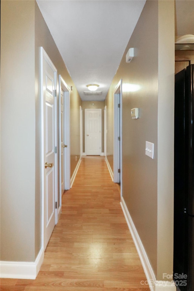 corridor featuring light wood-type flooring