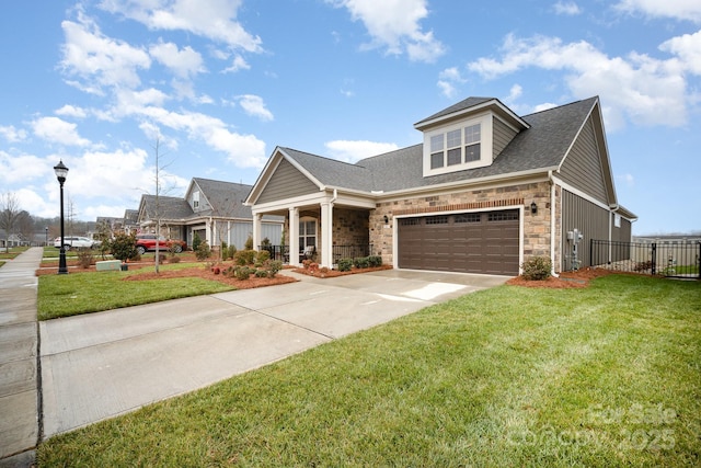 view of front of house featuring a front yard and a garage