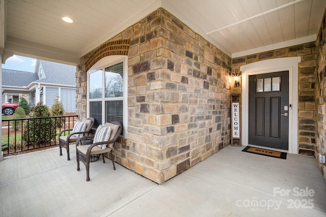 doorway to property featuring a porch