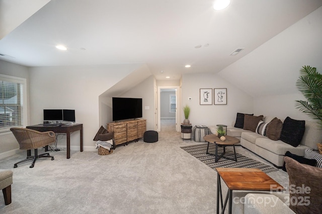 living room featuring carpet and lofted ceiling