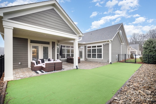 back of property with an outdoor hangout area and a patio