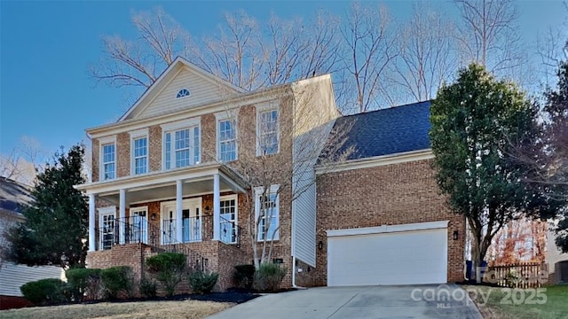 view of front of house featuring covered porch and a garage