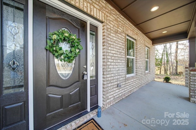 doorway to property with a porch