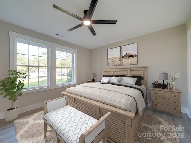 bedroom featuring hardwood / wood-style floors and ceiling fan