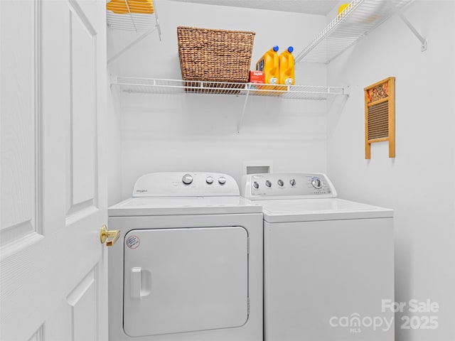 washroom with separate washer and dryer