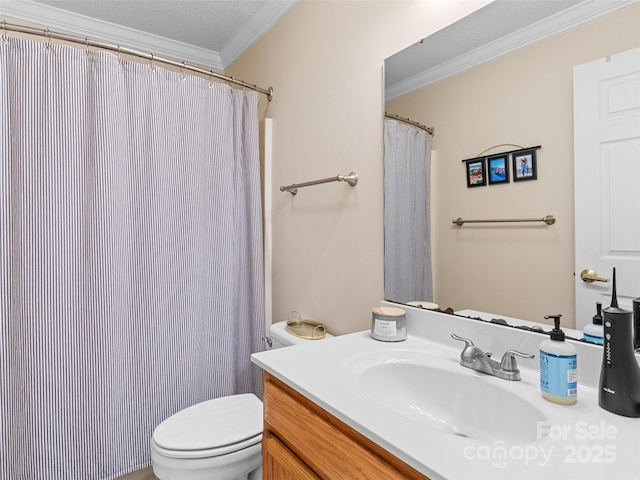 bathroom featuring vanity, toilet, ornamental molding, a textured ceiling, and curtained shower