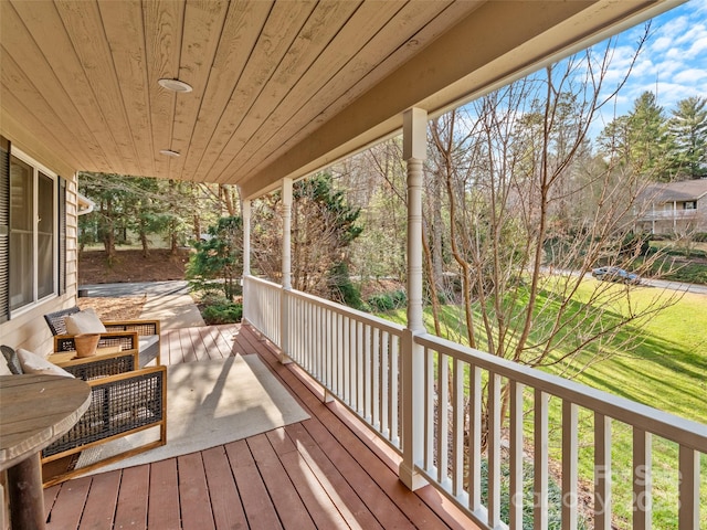 wooden terrace featuring a porch