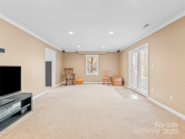 sitting room with light carpet and ornamental molding