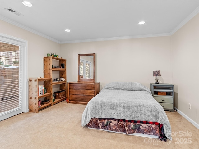 carpeted bedroom with ornamental molding