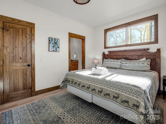 bedroom with hardwood / wood-style flooring