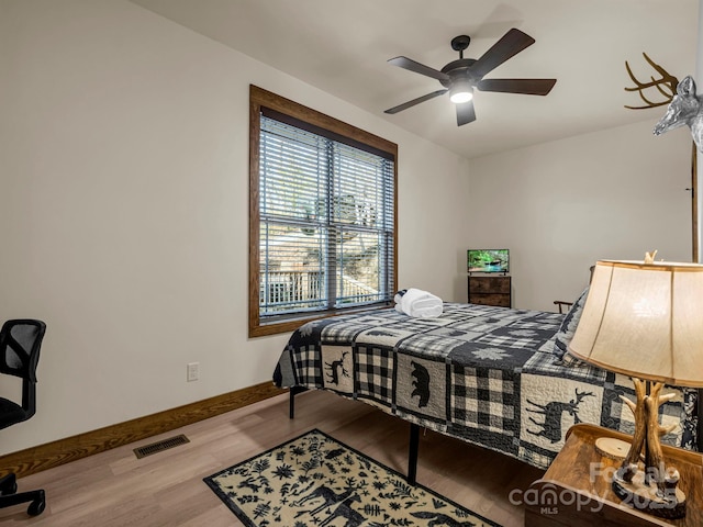 bedroom featuring ceiling fan and light hardwood / wood-style floors