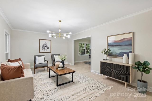 living room featuring wood-type flooring, crown molding, and a chandelier