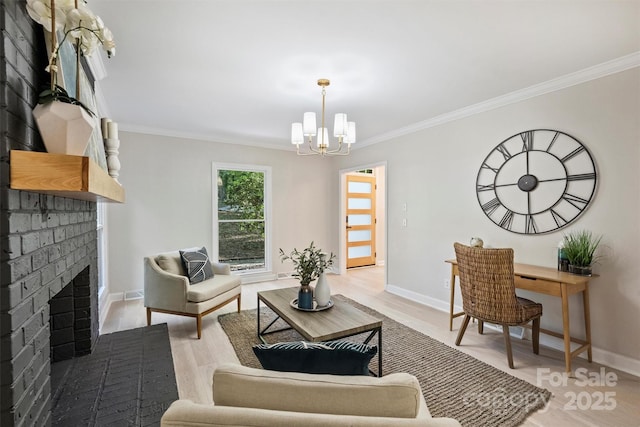 living room featuring ornamental molding, a fireplace, and an inviting chandelier