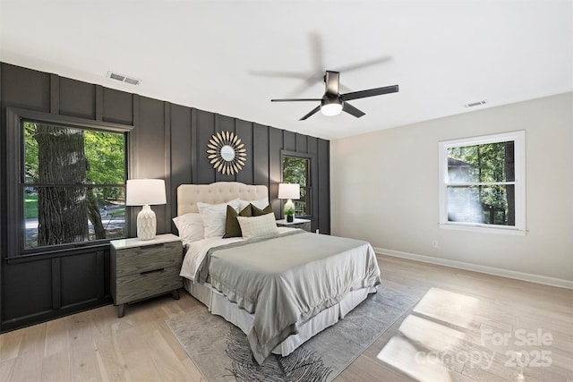 bedroom with ceiling fan and light wood-type flooring