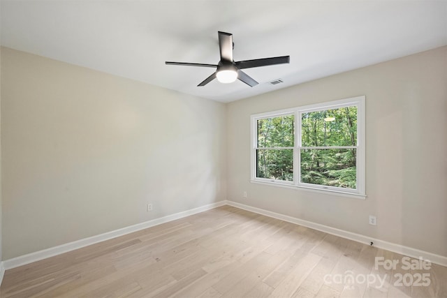 spare room with ceiling fan and light hardwood / wood-style flooring