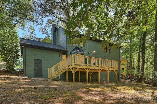 back of property featuring a deck