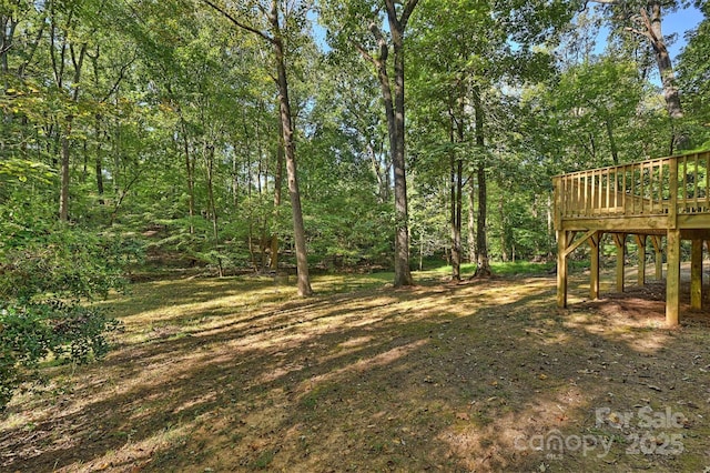 view of yard with a wooden deck