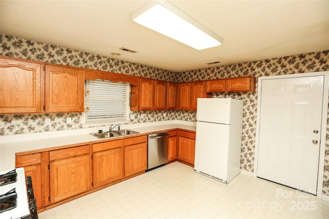 kitchen featuring white appliances and sink