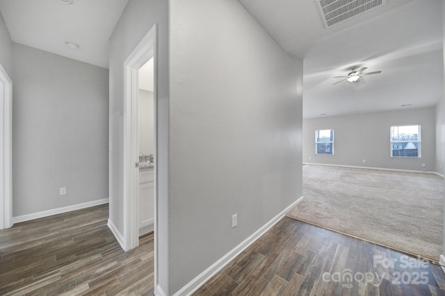 hallway featuring dark hardwood / wood-style flooring