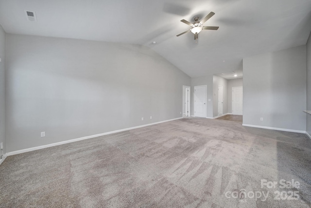 unfurnished living room featuring carpet, vaulted ceiling, and ceiling fan