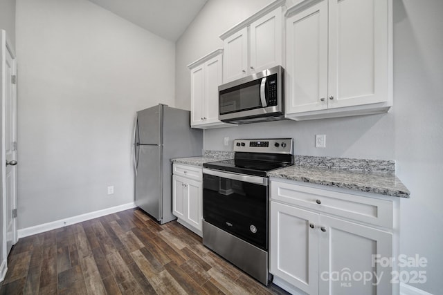 kitchen featuring light stone counters, white cabinetry, and appliances with stainless steel finishes