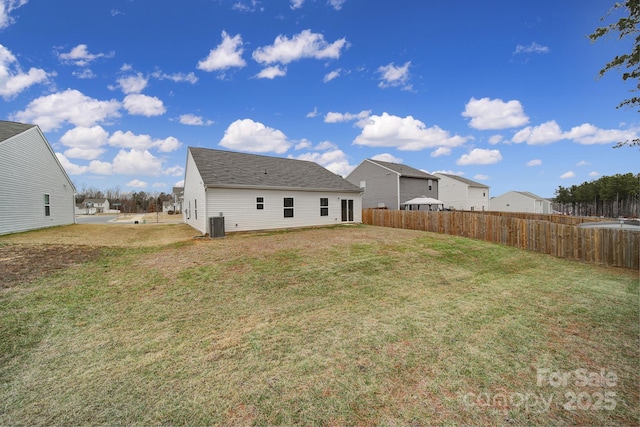 back of house with a lawn