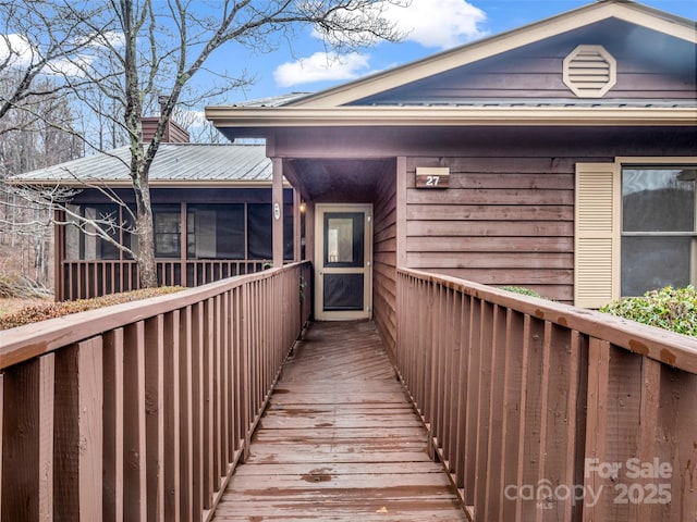 exterior space featuring a sunroom