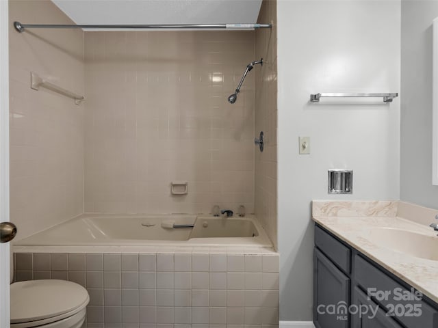 full bathroom featuring vanity, toilet, and tiled shower / bath combo