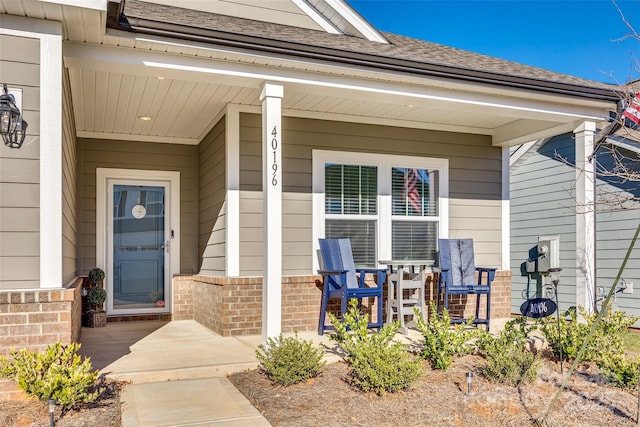 doorway to property featuring covered porch