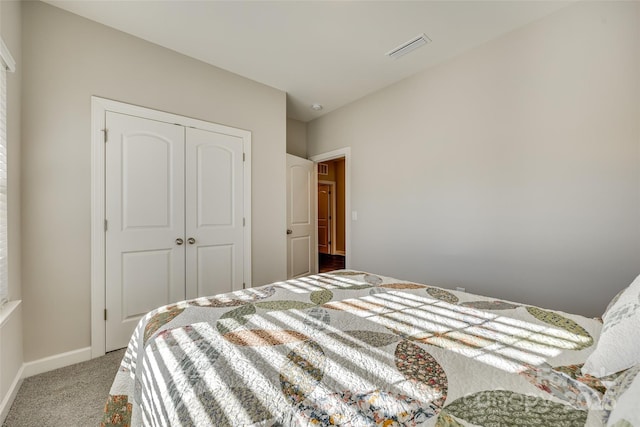 carpeted bedroom with a closet