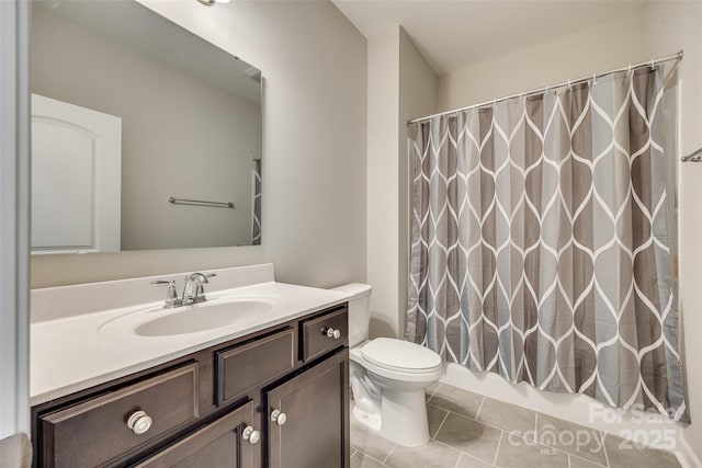 bathroom with a shower with shower curtain, tile patterned floors, vanity, and toilet