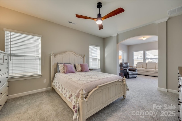 bedroom with ceiling fan and light colored carpet