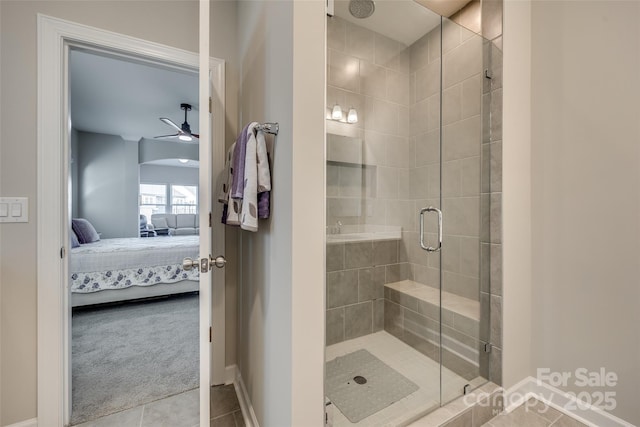 bathroom with an enclosed shower, tile patterned floors, and ceiling fan