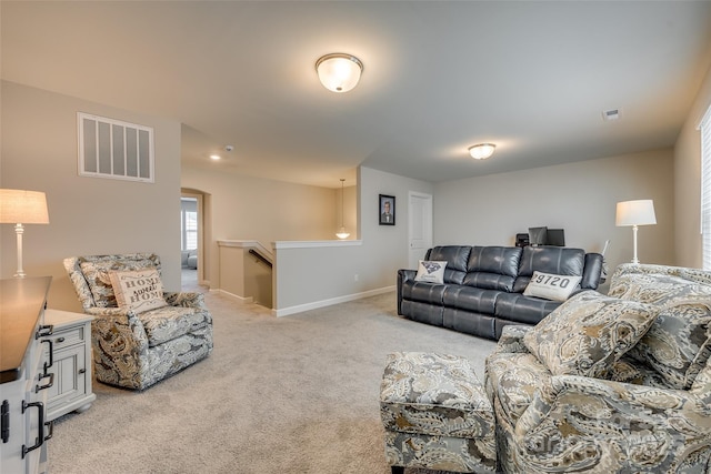 living room featuring light carpet