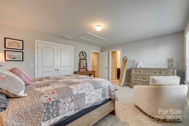 bedroom with light colored carpet and a closet