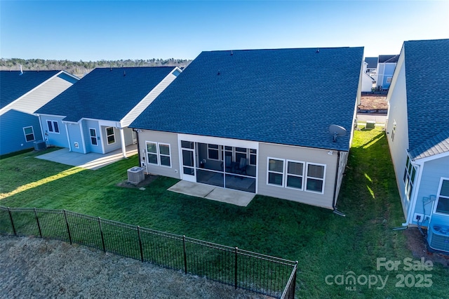 back of house featuring a lawn, a patio area, and central AC unit