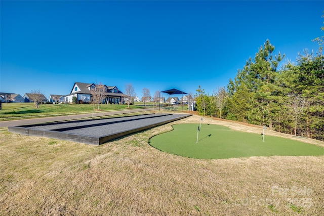 view of home's community featuring a lawn